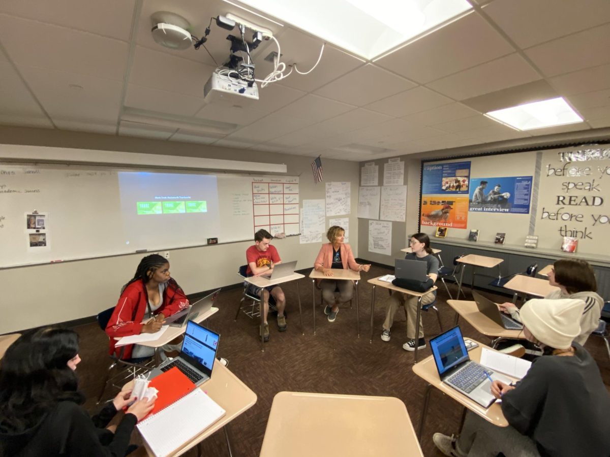 PRESS TIME: At the beginning of class, Journalism students in Mrs. Scholl's classroom hold a staff meeting. They discuss the newsworthiness of events affecting MCHS and its students.