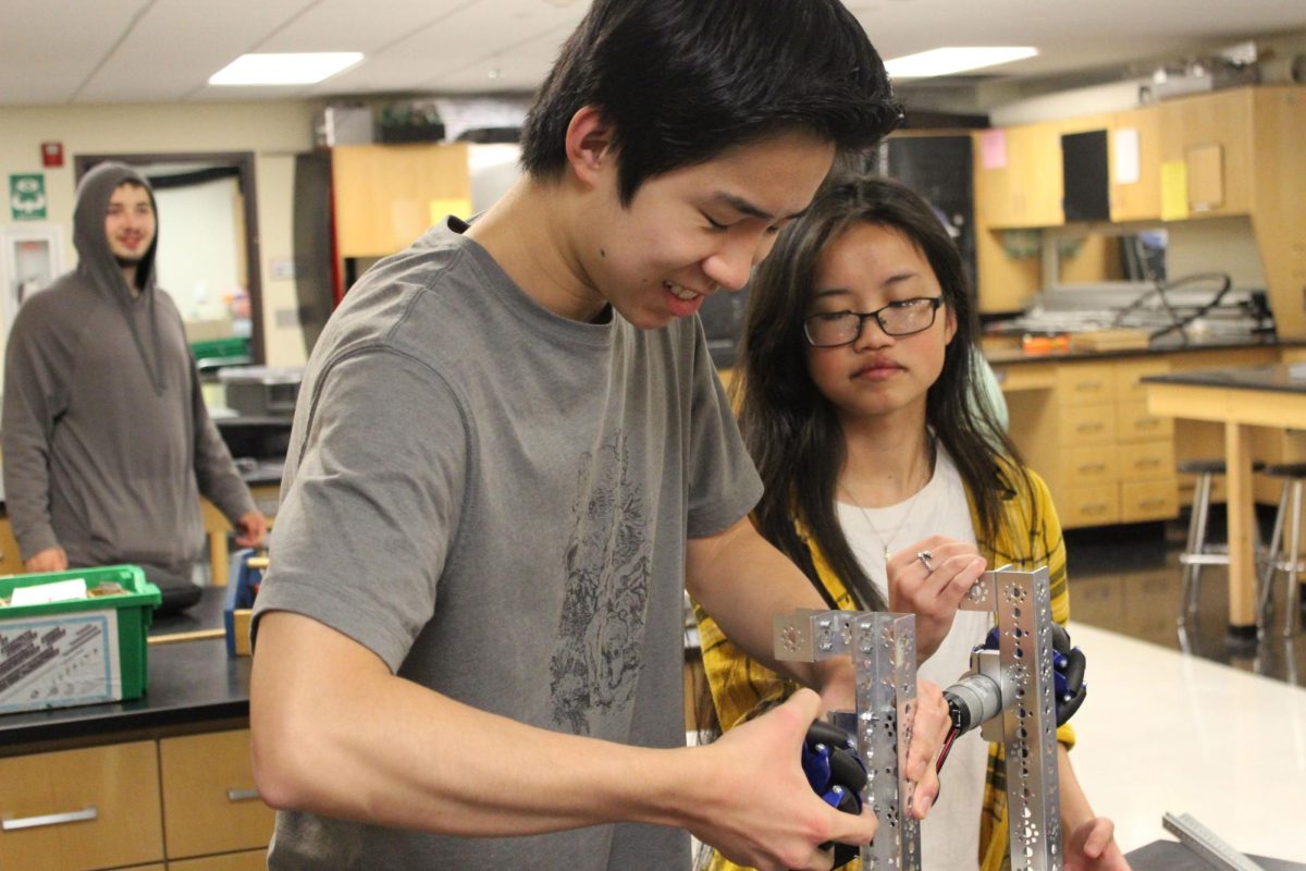 Johnny and London Philpott working side-by-side on last year's Robotics Club design. This year's the club has a theme is inspired by an ocean theme.