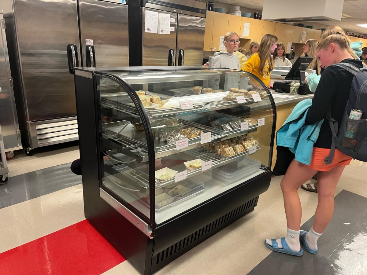 Katie Sievers works behind the counter  selling baked goods to students on Friday mornings. 