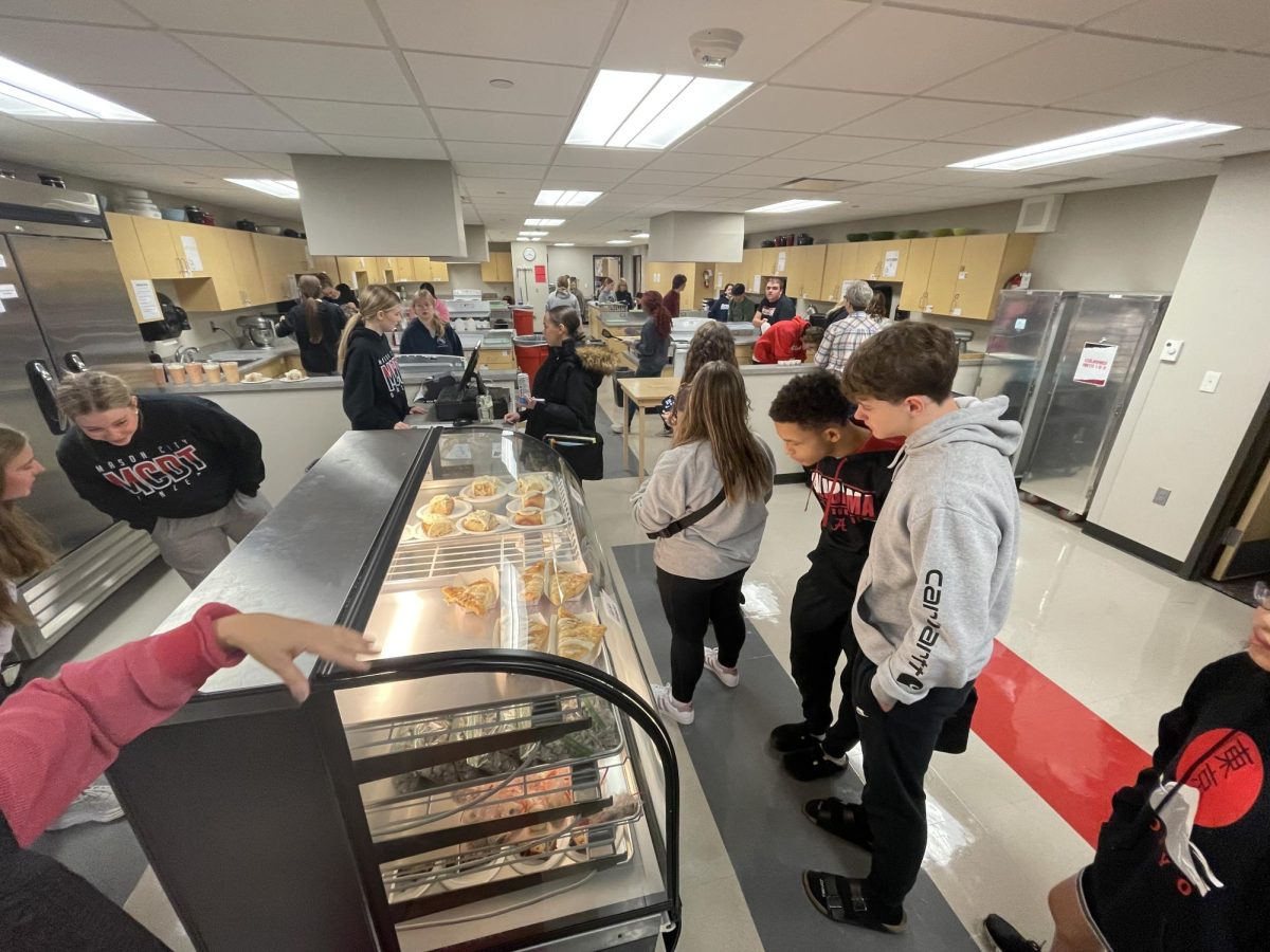 Sophomore Chase Lacour eyes the tempting treats at the Riverhawk Bakery.