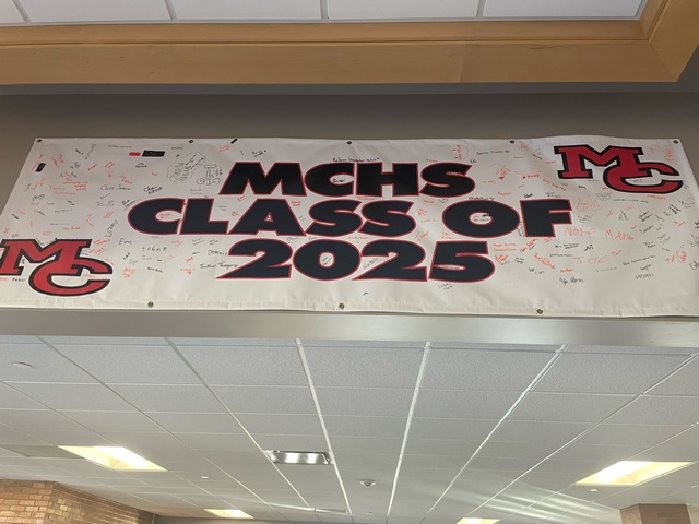 The class of 2025's banner hangs in The Commons of MCHS. It bears the signatures of students from their freshman year when they agreed to do their best and graduate on time.