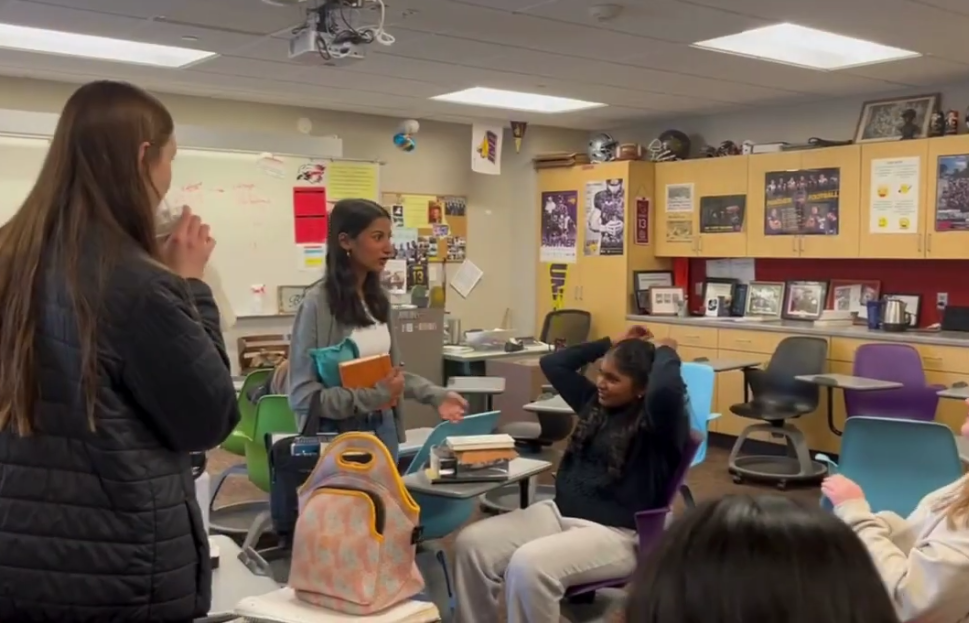 Junior Sofia Ahari interacts with fellow students before Mr. Lee's NIACC US History class. 