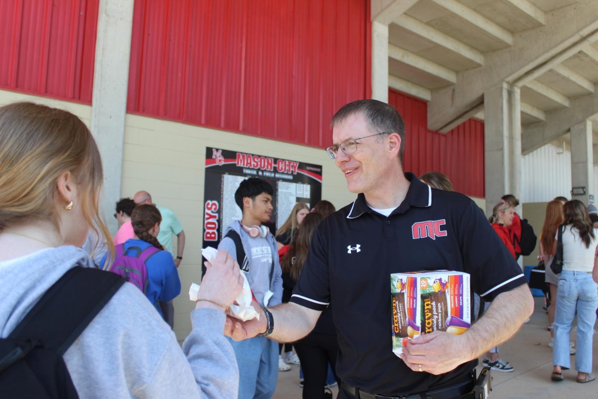 Principal Dan Long hands out ice cream and popcicles to students to kick off an ISASP Reward Day.