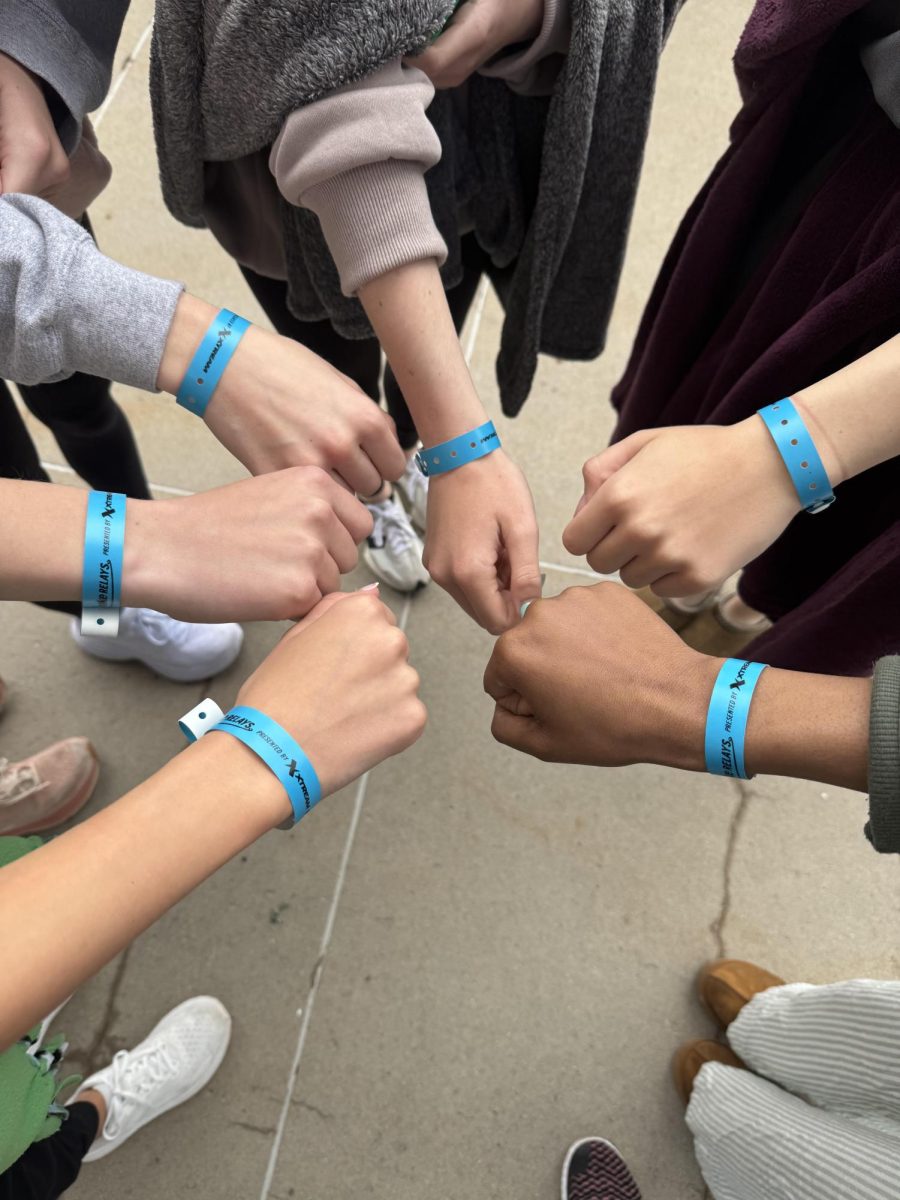 The girls' 4x100 meter relay team shows off their wristbands prior to their race at Drake Relays. They ran the 4x100m race in 51.57 seconds. Photo courtesy of Savannah Davis. 