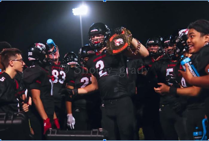 Thomas Medlin winning turnover chain after getting interception.