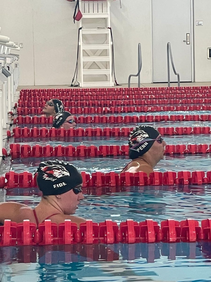 Seniors Kayla Eide and Ryleigh Penn in MCHS Natatorium will swim for the Riverhawks in Iowa Alliance Conference Meet.