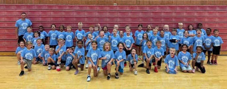 Kindergarten and 2nd Grade Talons players with MCHS Head Basketball Coach Nic Trask.