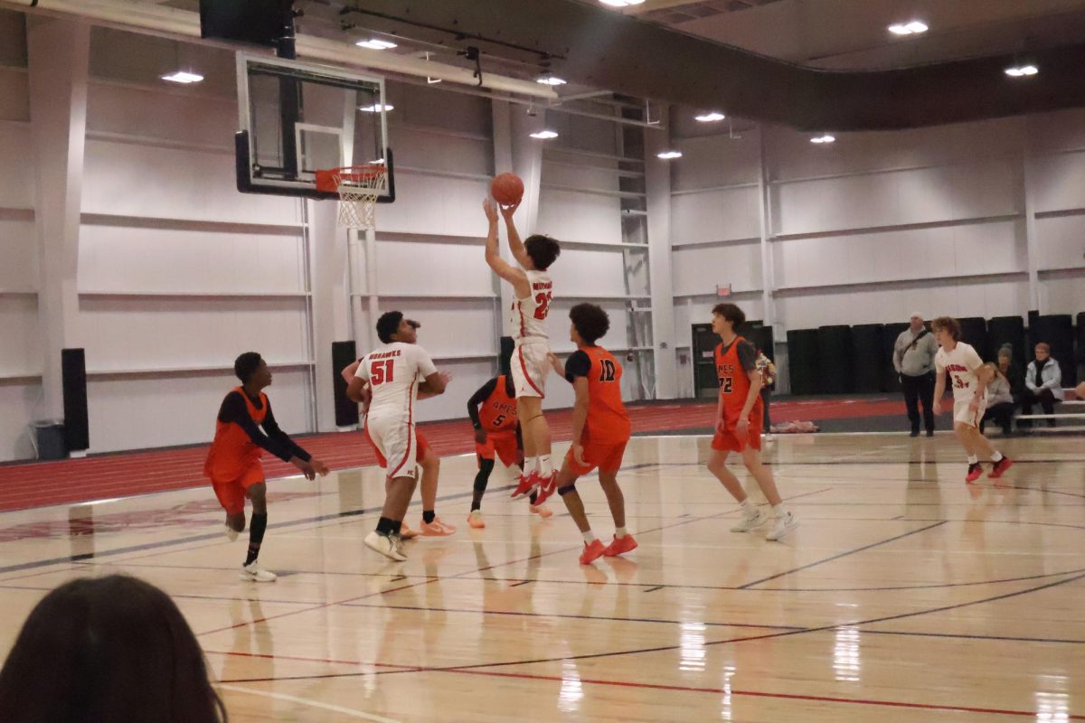Nate Borchardt takes a jumpshot for the sophomore team against Ames.