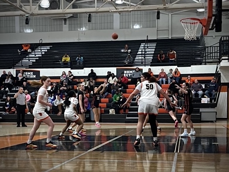 Senior Brogan Evans shoots a three-pointer during the second half. Photo courtesy of girls' basketball manager Leah Gerriets. 