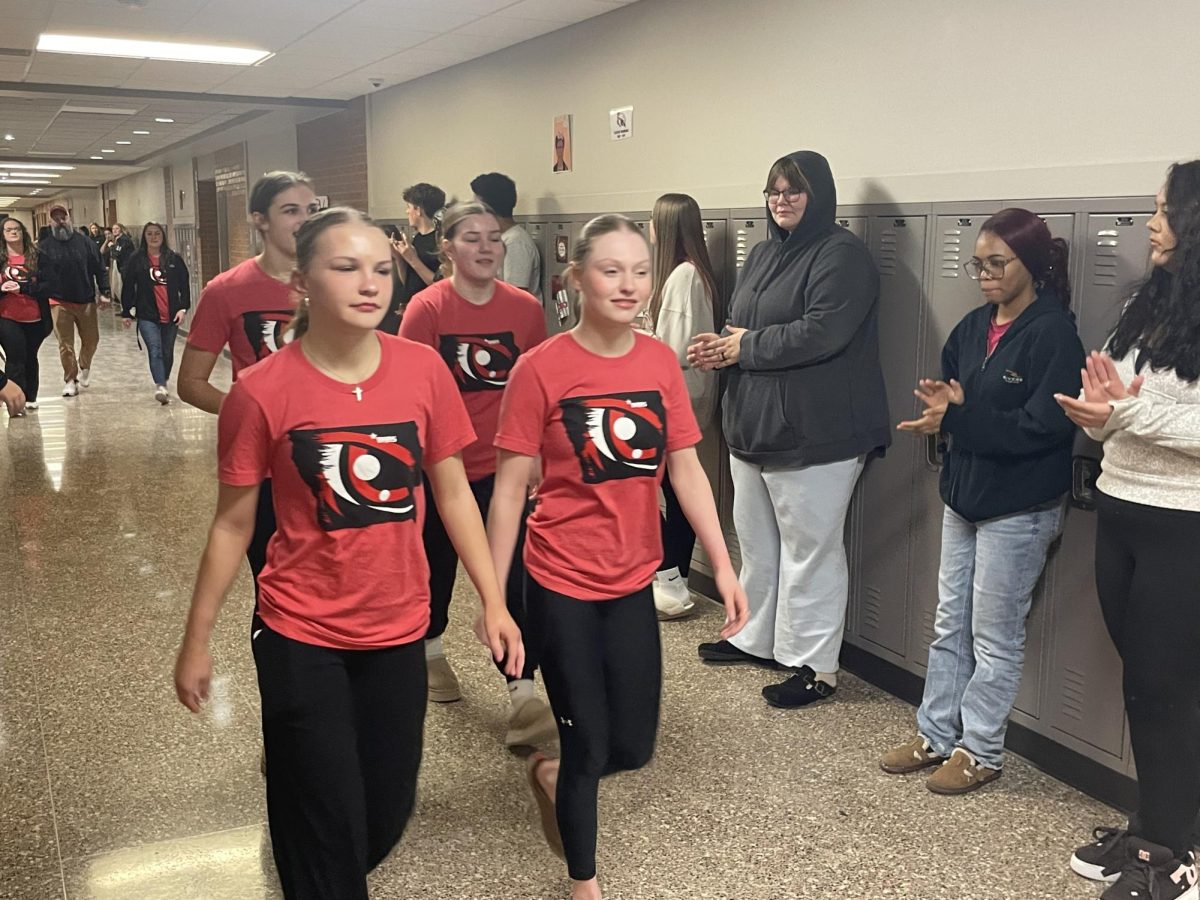 MCHS wrestlers Allie Robbins, Piper Phillips, Carleigh Arjes, and Trista Pike get a high school sendoff before heading to the state tournament in Coralville Thursday.
