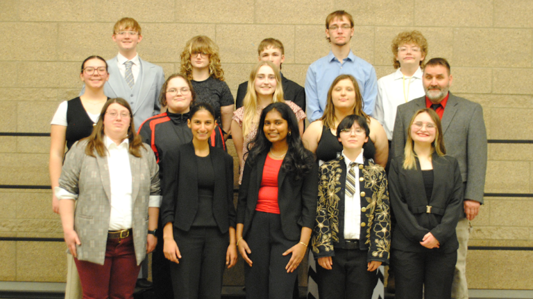 MCHS Academic Decathlon team poses together for a photo on the first day of the competition. Back Row L-R: Max Tripp, Max Shelton, Logan Peterson, Mason Walters. Middle Row: Ryleigh Penn, Donatello Tietz, Brooklyn VanHauen, Rain Sanchez, Coach Hines. Front Row: Coach Yarrow, Sofia Ahari, Kaitlyn Thangaraj, Mya Sanchez, Julia Hines. Courtesy of MCHS Academic Decathlon.