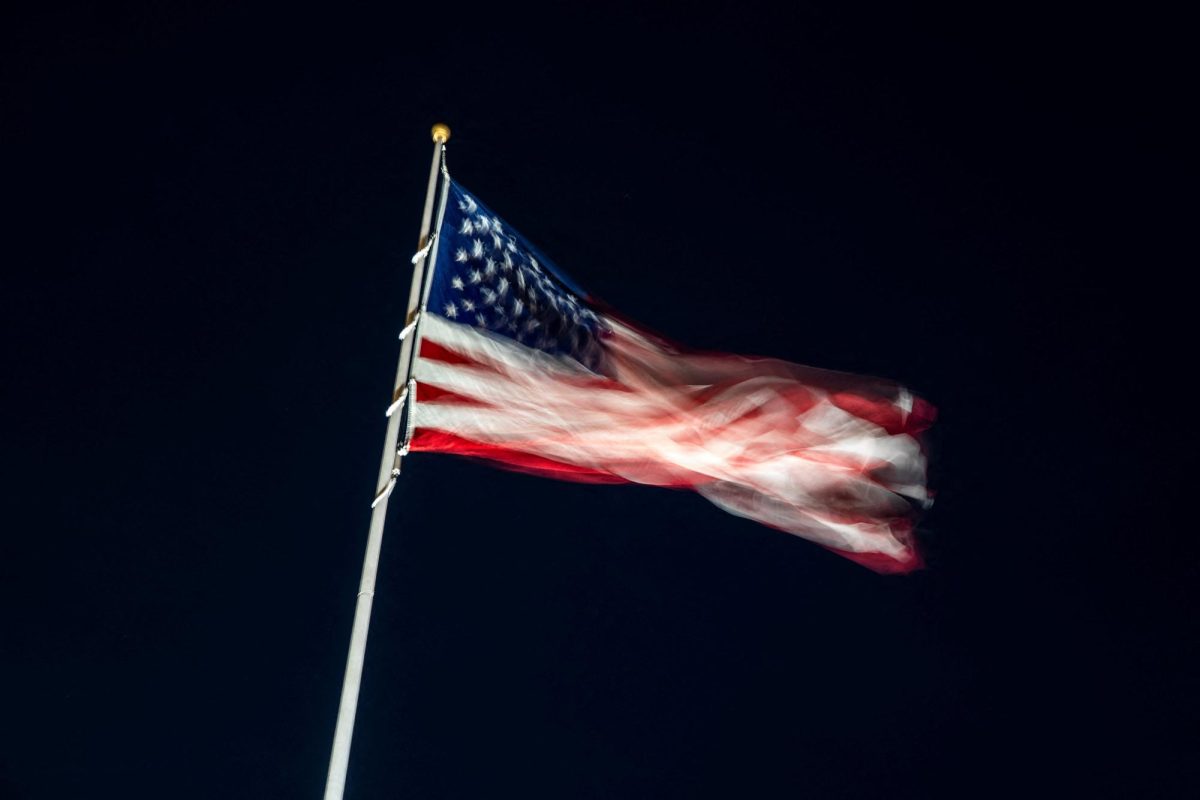 An American flag flutters on the South Lawn ahead of U.S. President Donald Trump's arrival at the White House, after Israel and the U.S. launched strikes on Iran, in Washington, D.C., U.S., March 1, 2026. REUTERS/Nathan Howard
