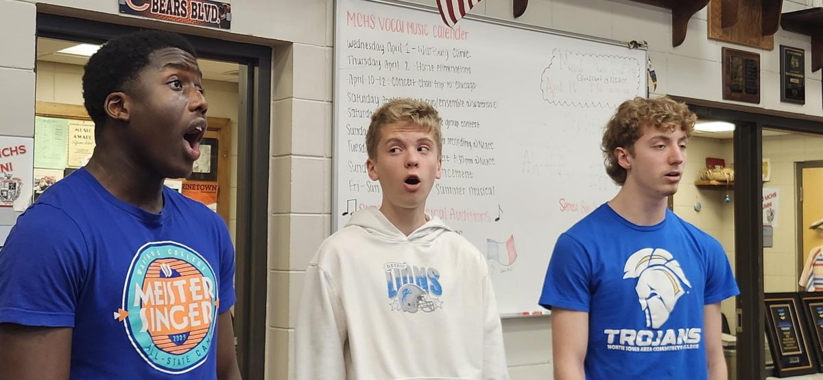 Bass Clef Choir members Zion Ondoma, Henry Hansen, and Zerik Nicholson harmonize vocals while singing "Prayer of the Children". “[It’s] a piece dealing with the Bosnian conflicts of the ‘90s,” said Associate Director of Choral Activities Matthew Jensen, “but is applicable to what's happening today all over the world.” The students will perform the song during Large Group Contests in Cedar Falls in May.
