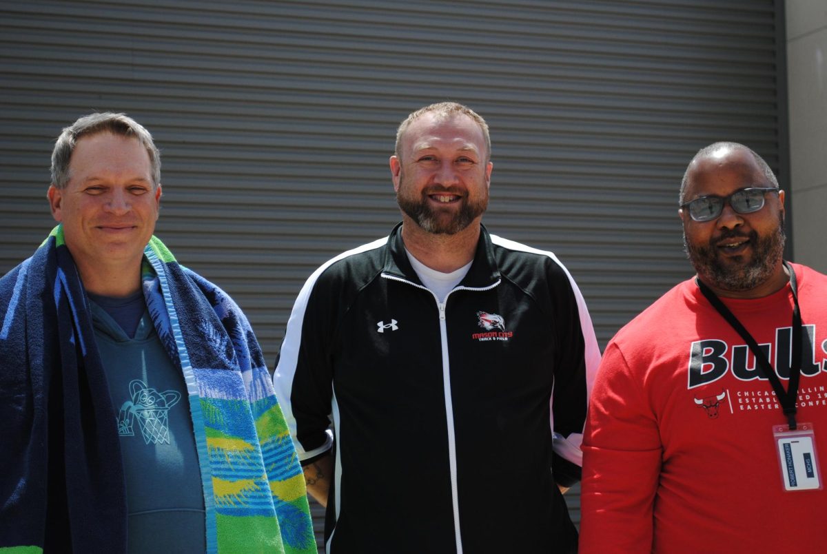 Math teacher Bryan DeGabriel, iJAG instructor Tyler Hunt,  and BI Robert Honaker are smiling for the camera preparing to get dunked in the cool weather.  (May 20, 2026)